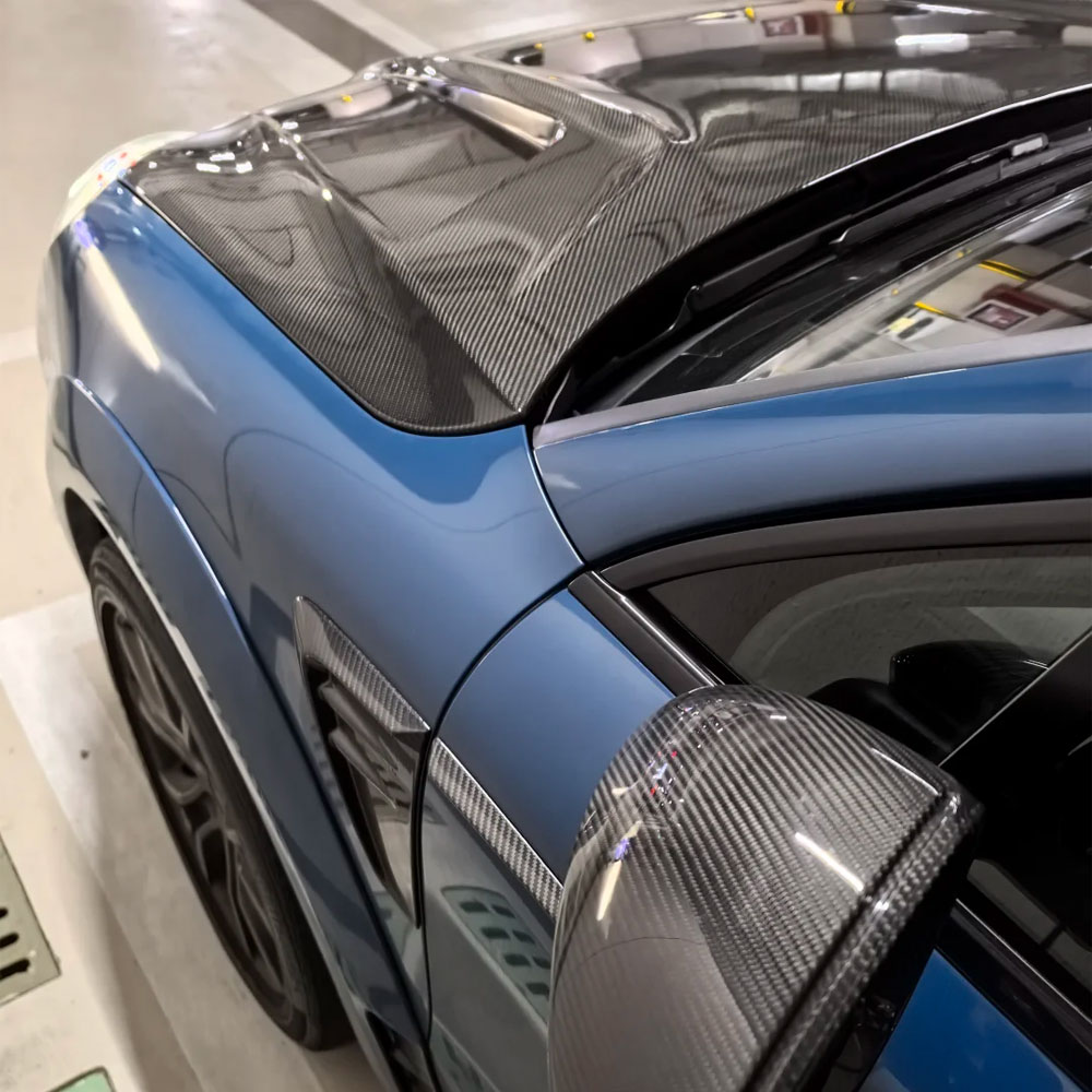Close-up of 5D black carbon fiber texture paint protection film